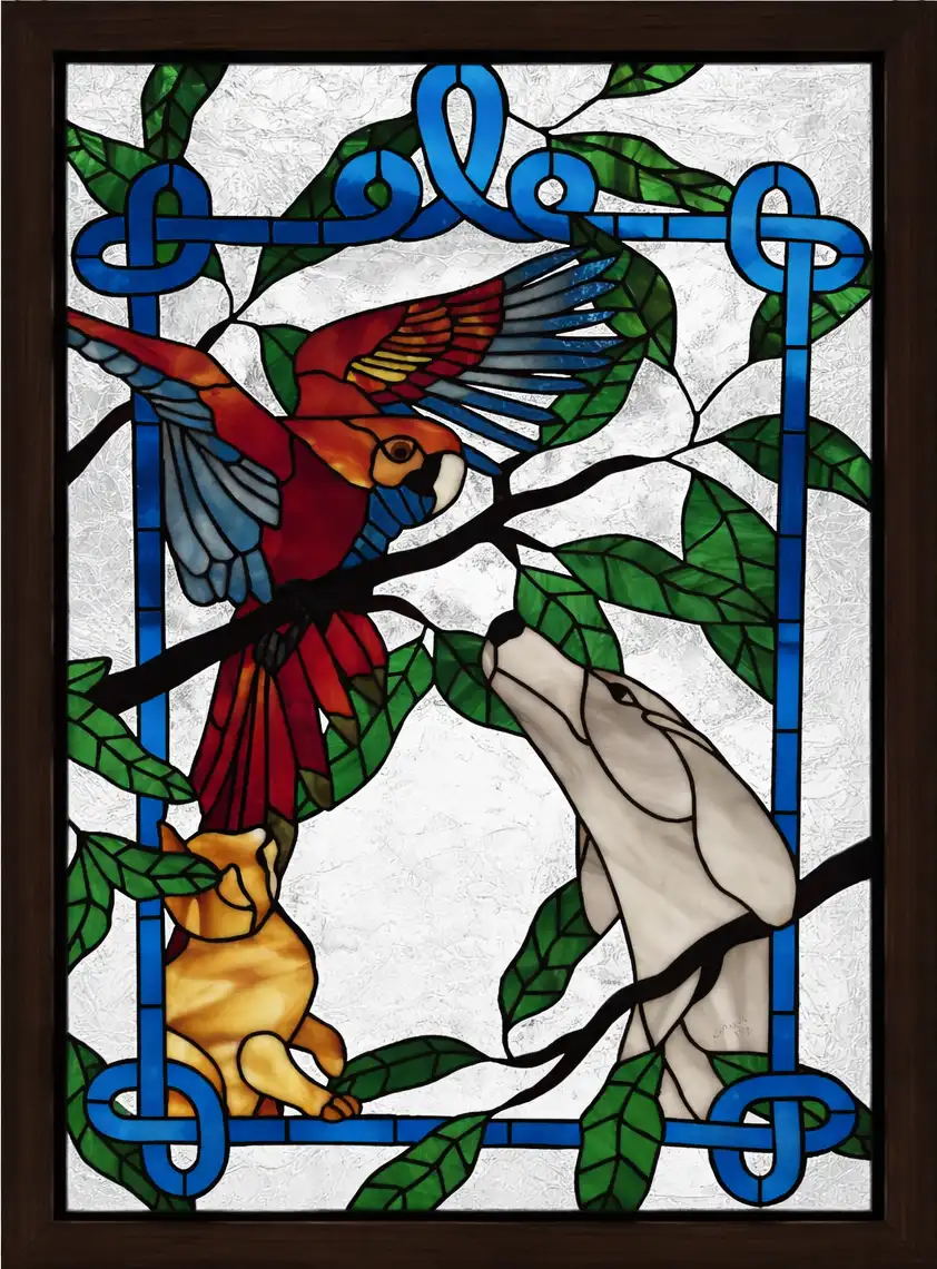Stained glass artwork at Gold Beach Veterinary Clinic featuring a dog, cat, and parrot